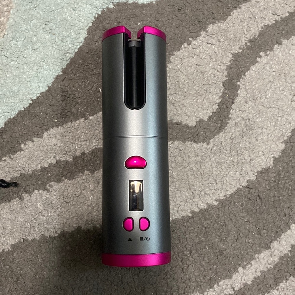 Automatic hair curler. Put a piece of hair in the barrel and it does it for you!